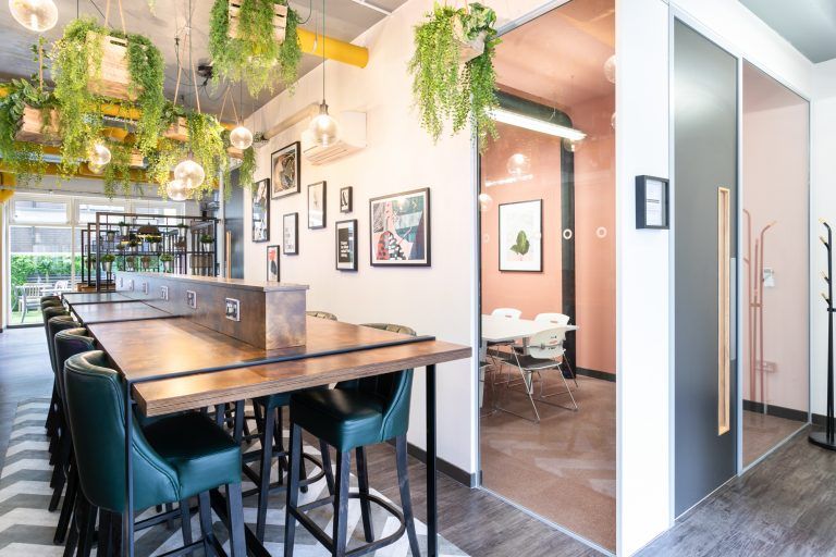 Modern dining room with communal table for collaborative meetings and events.