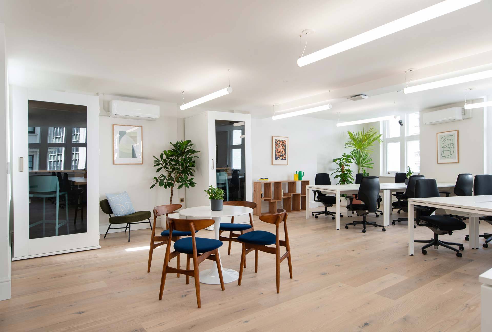 Modern dining room with flexible seating for workshops and team meetings.