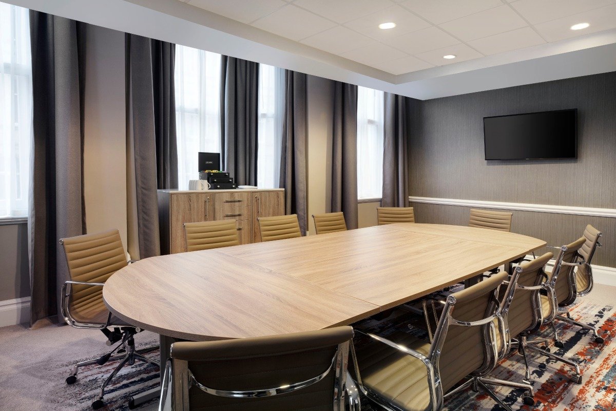 Modern conference room in Raglan Suite, Leonardo Hotel Cardiff, ideal for meetings and presentations.