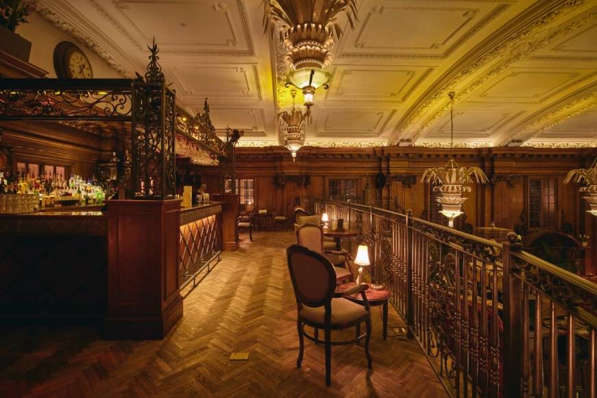 Elegant live music bar with rich wood paneling, ideal for upscale events and gatherings.