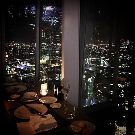 Sophisticated dining setup with city skyline view at Oblix, ideal for corporate events.