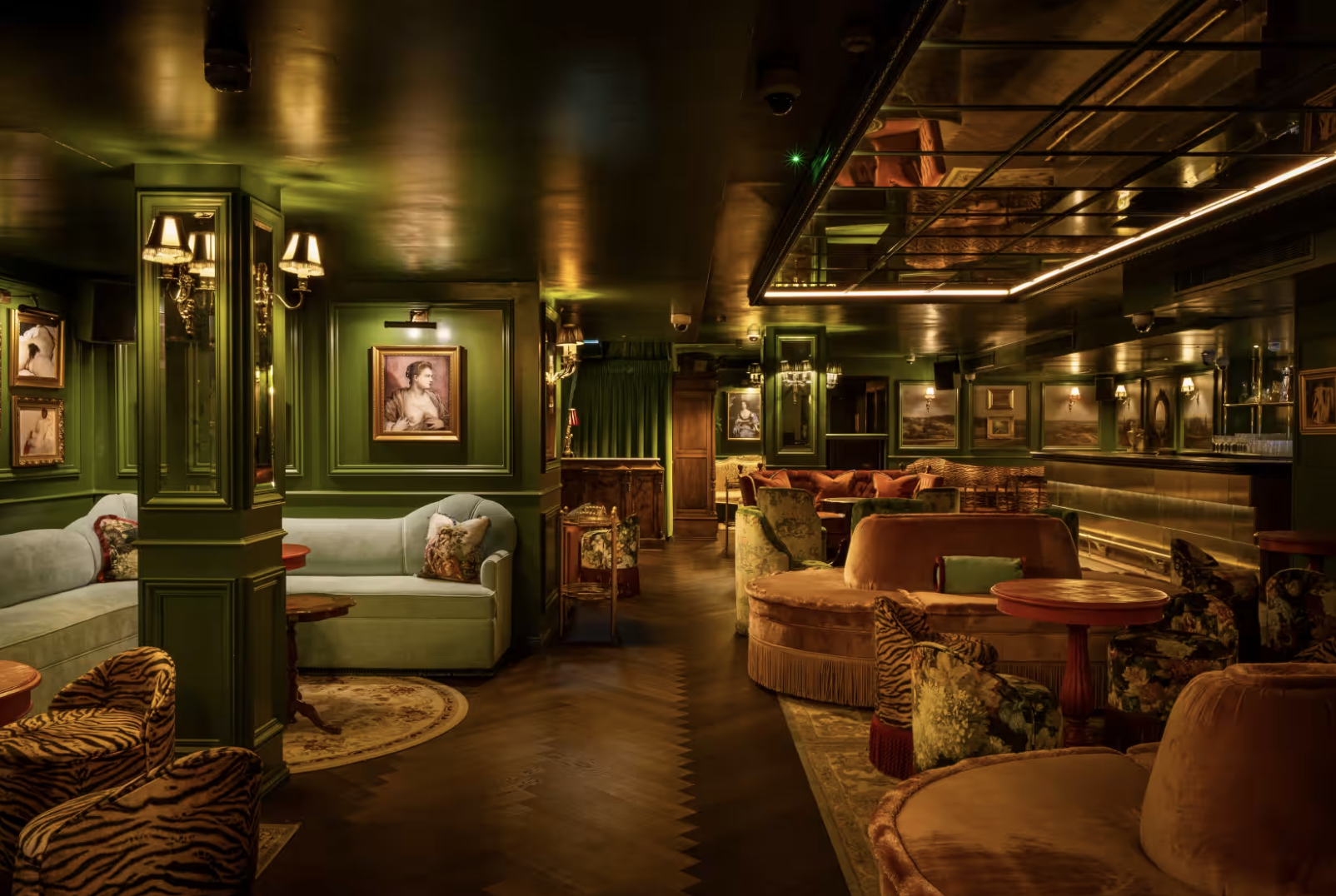 Stylish intimate venue in Dear Darling with rich green decor for upscale events.