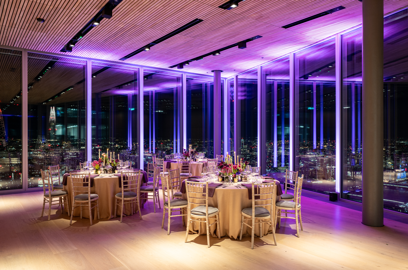 Sophisticated event space at The Lookout, Bishopsgate with floral centerpieces and city views.