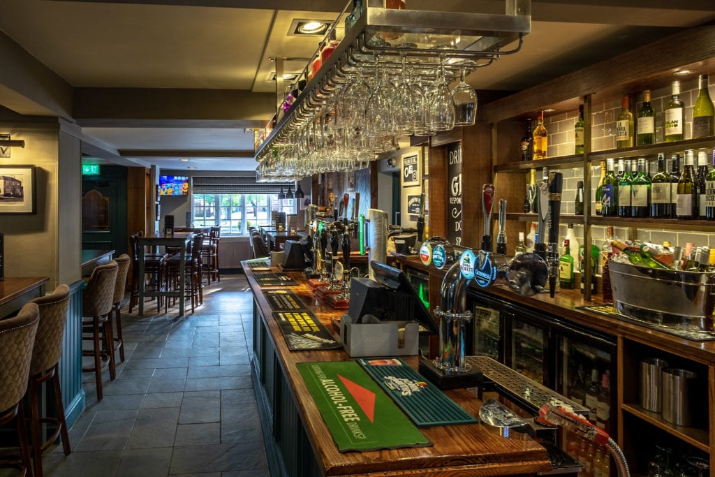 Inviting bar area in The Midway pub, perfect for networking events and informal meetings.