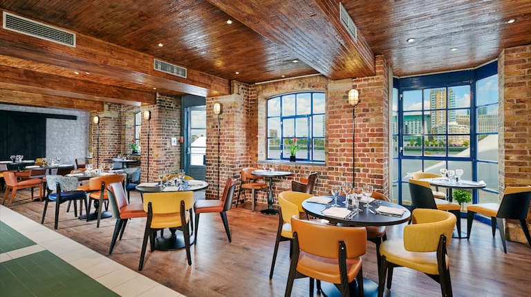 Banquet hall at DoubleTree by Hilton, featuring exposed brick for corporate events and private dinners.
