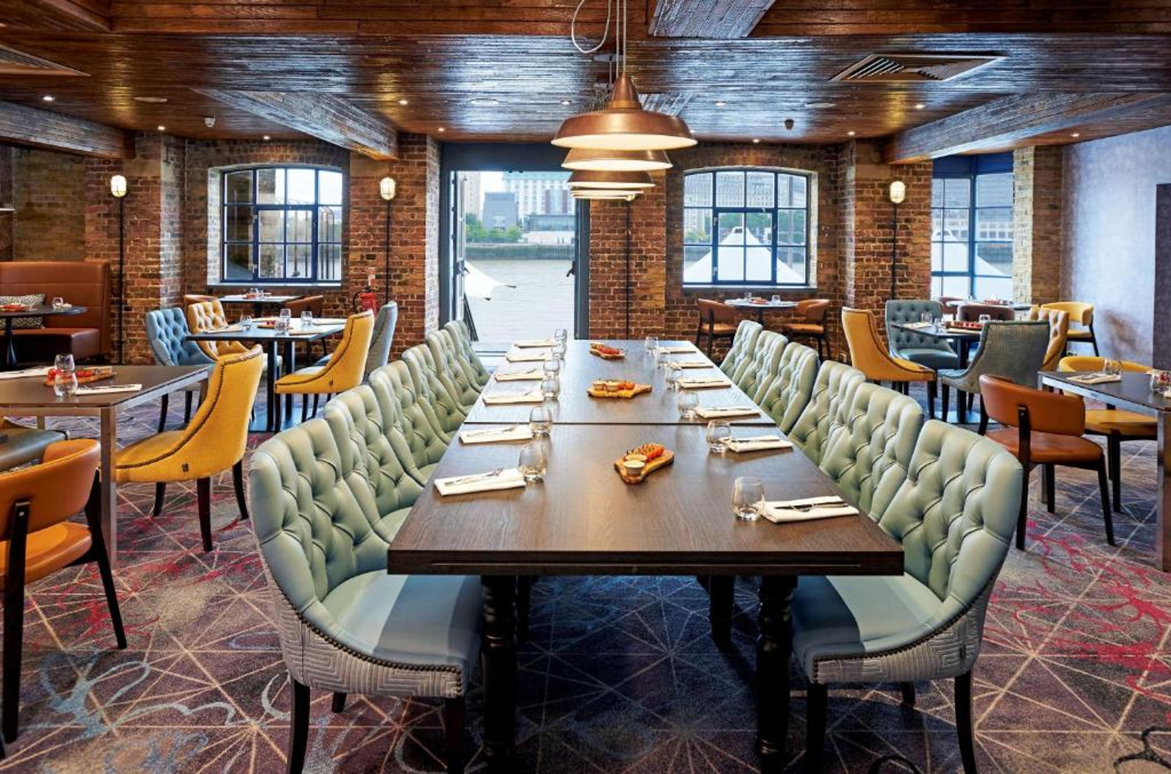 Elegant banquet hall at DoubleTree London, ideal for meetings and events with warm lighting.