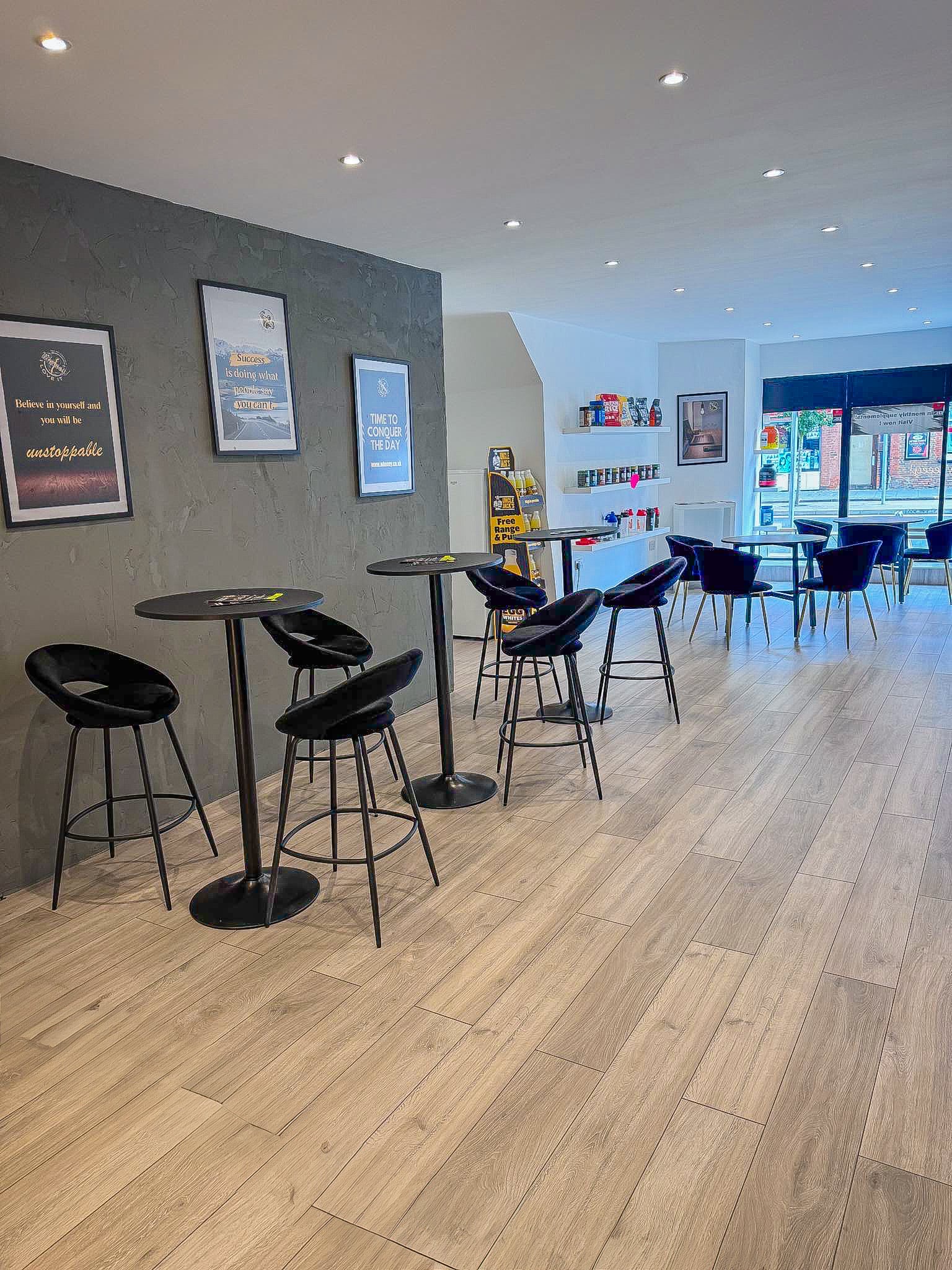 Modern event space with high-top tables, perfect for networking and casual meetings.