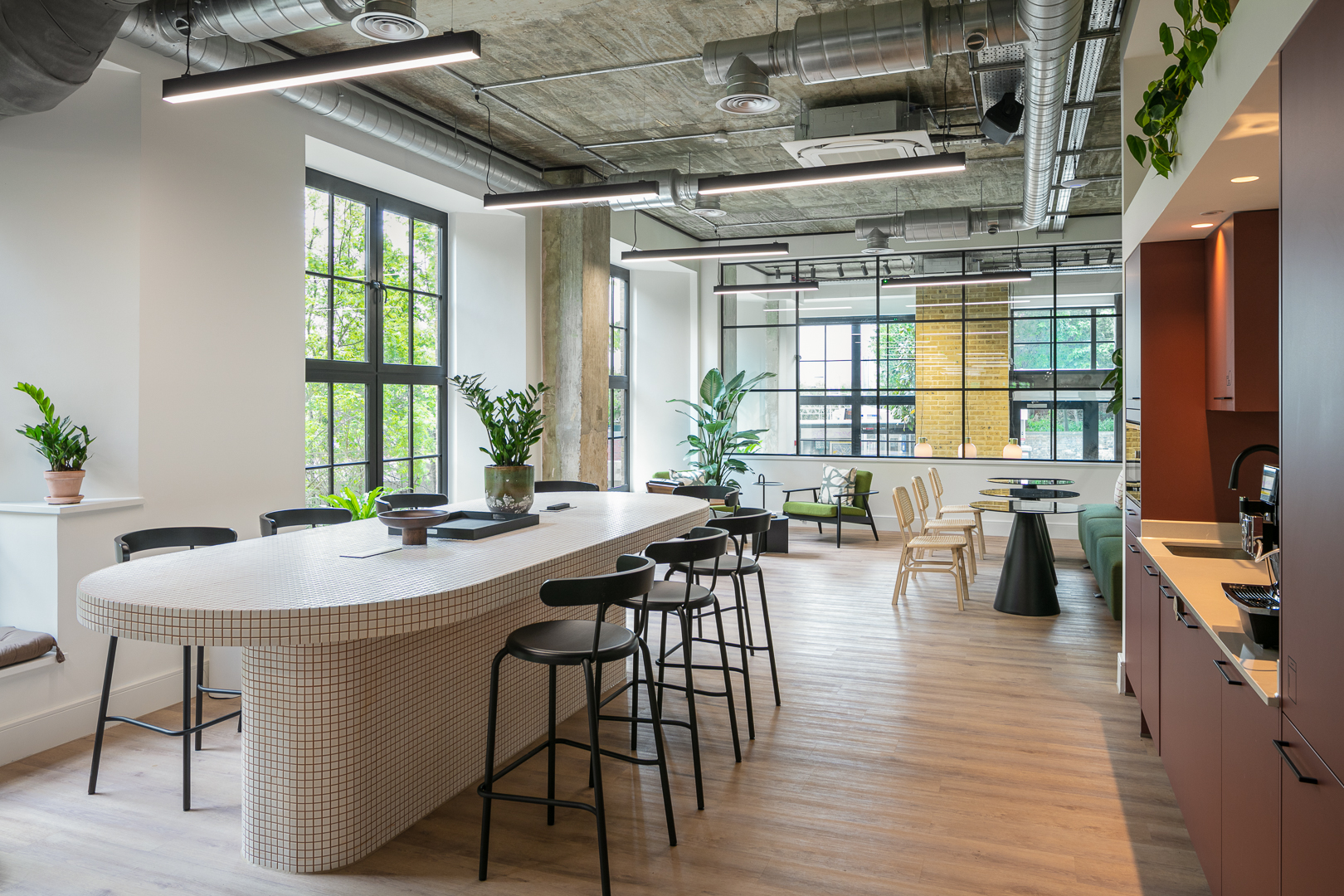 Modern collaboration room with large windows for meetings and brainstorming events.