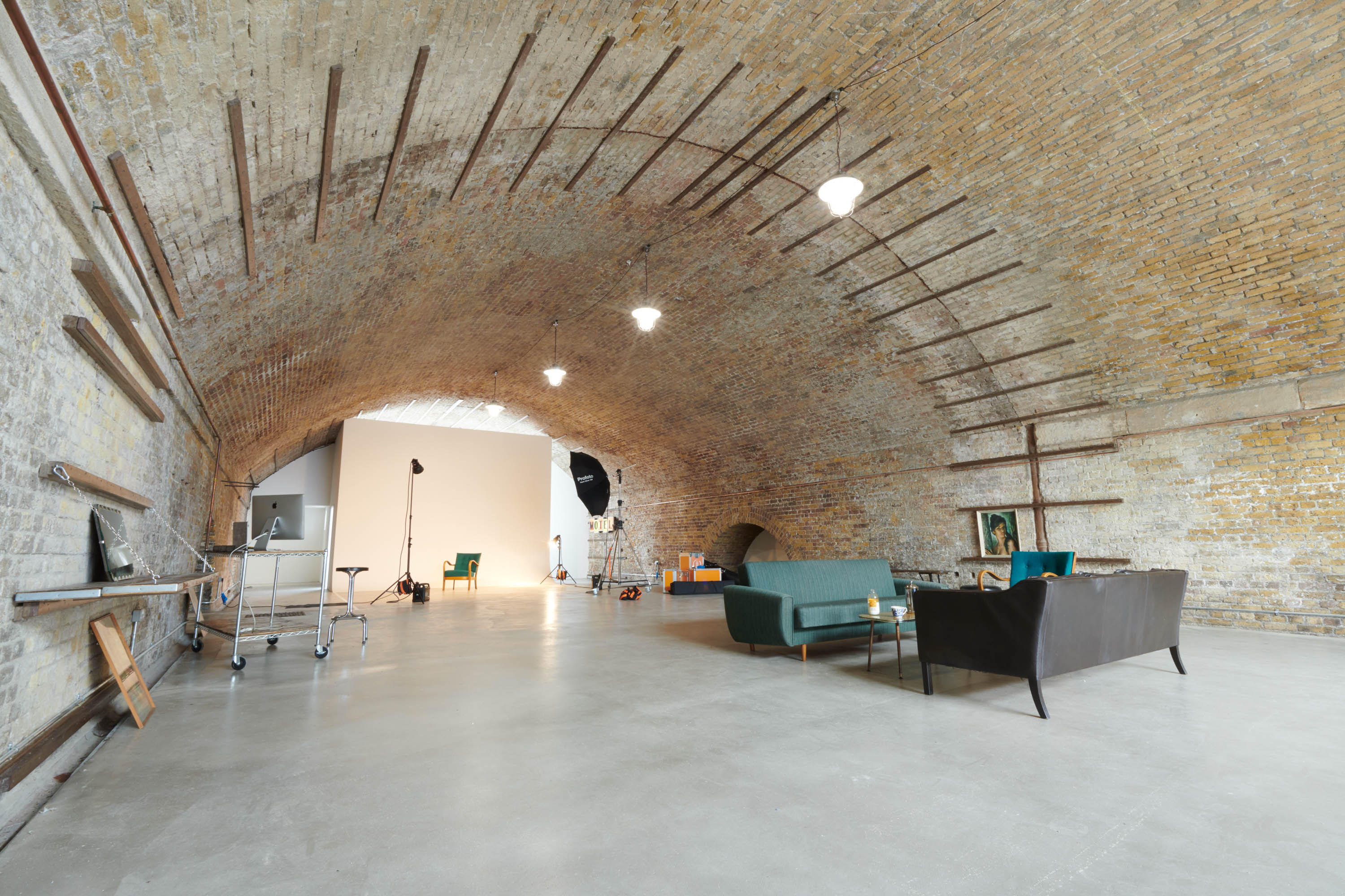 Wedding venue with arched brick ceiling, ideal for corporate events and workshops.