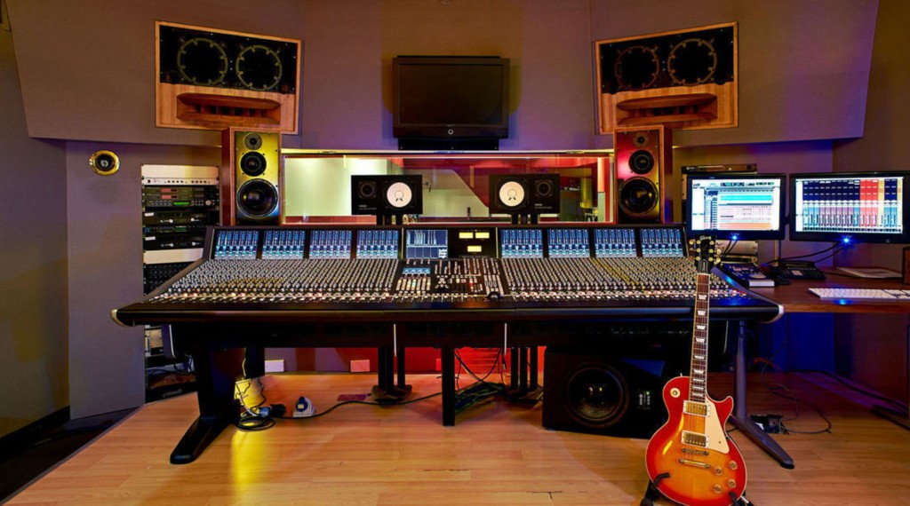 Professional recording studio with mixing console, ideal for music production workshops.