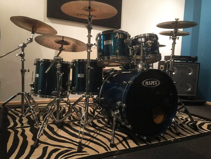 Professional drum kit in stylish K-Town Studios for live music events and rehearsals.