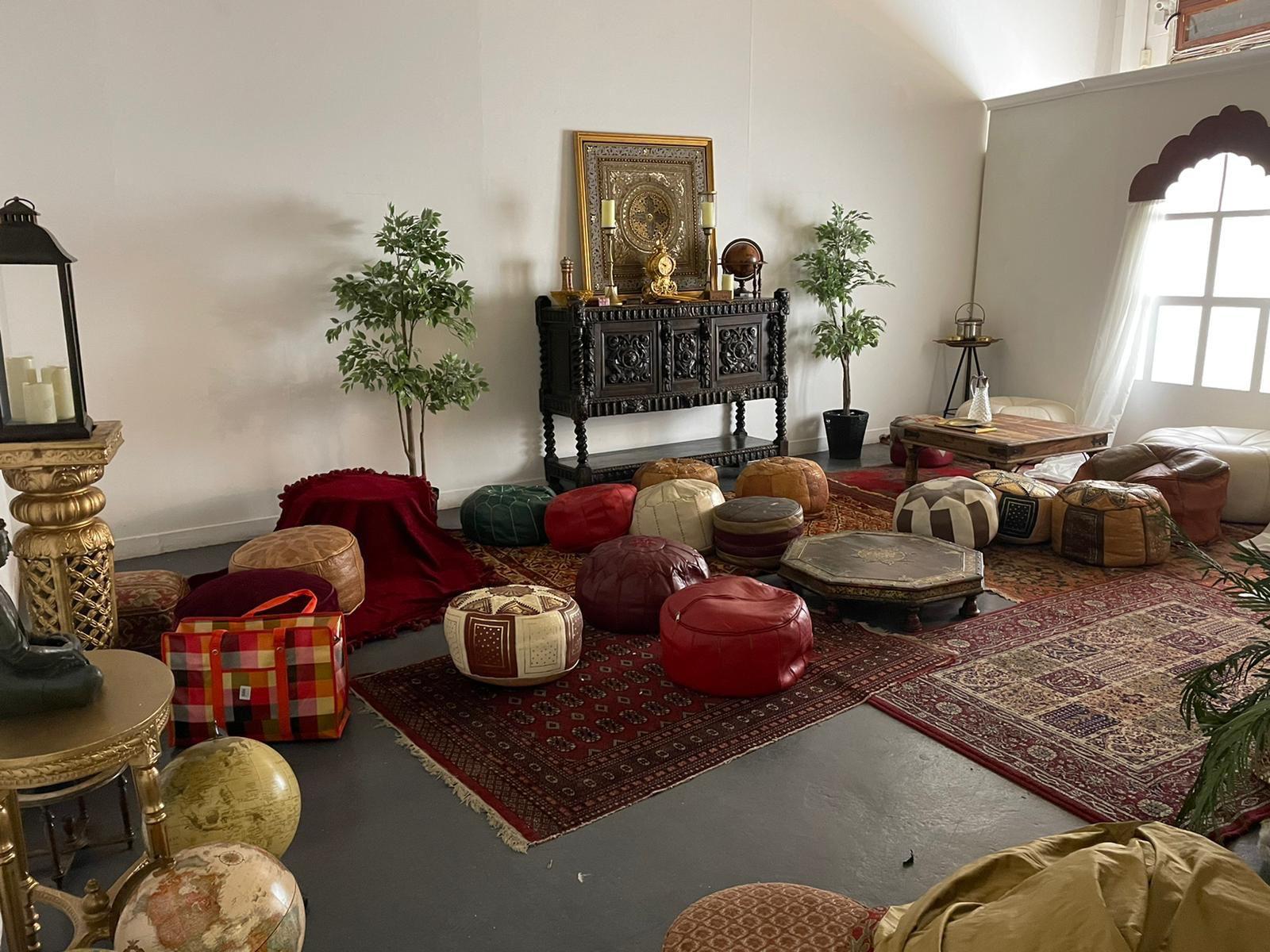 Cozy lounge area in enclosed Hoxton Arches backyard for casual networking events.