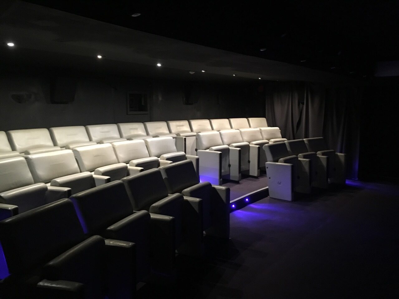 Contemporary tiered seating in Rio Cinema's Screen Room for engaging presentations and screenings.