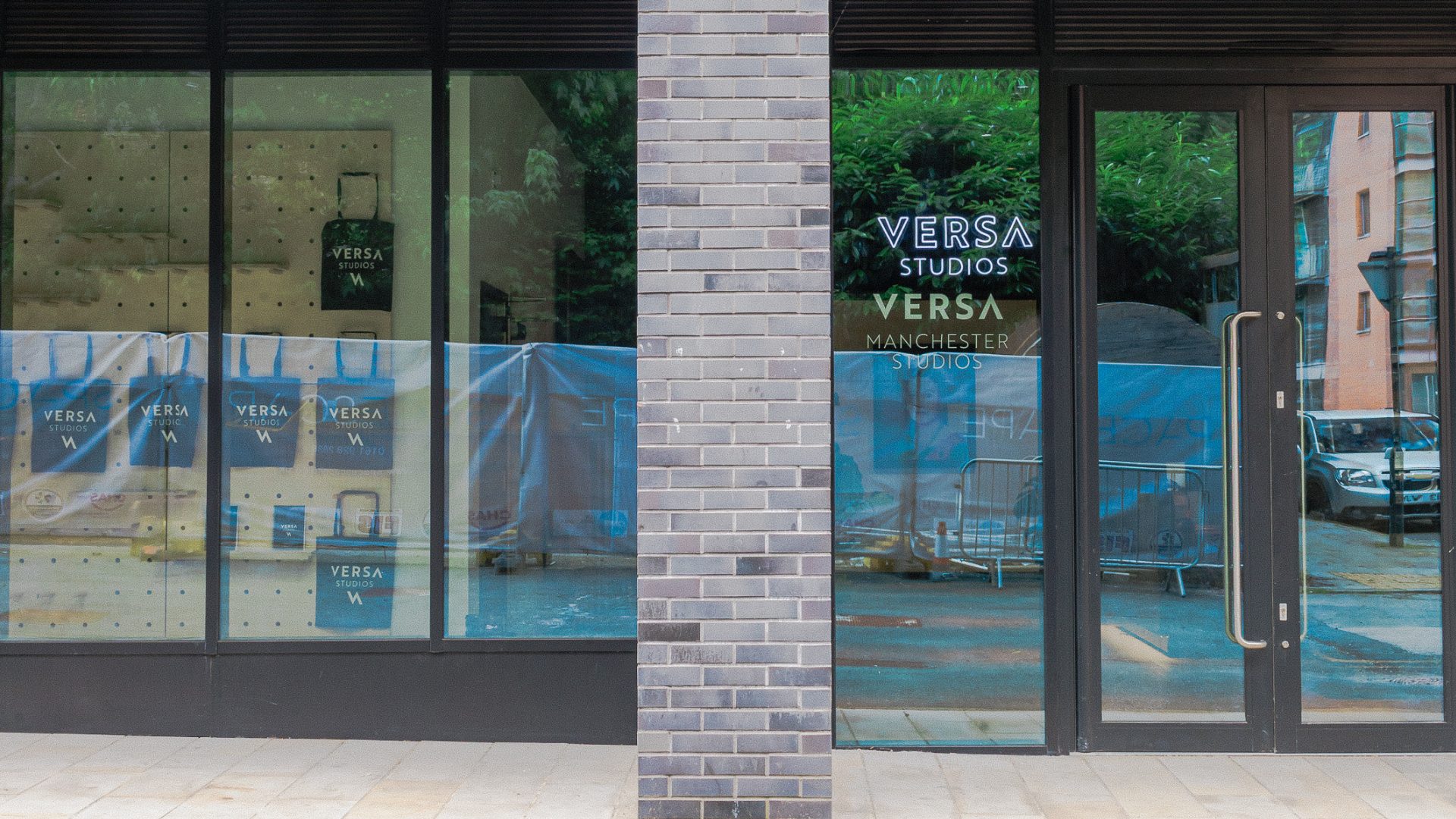 Modern venue entrance at Versa Studios, Manchester with large glass windows for events.