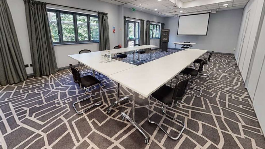 Modern meeting room at Village Hotel Bury, ideal for workshops and strategy sessions.