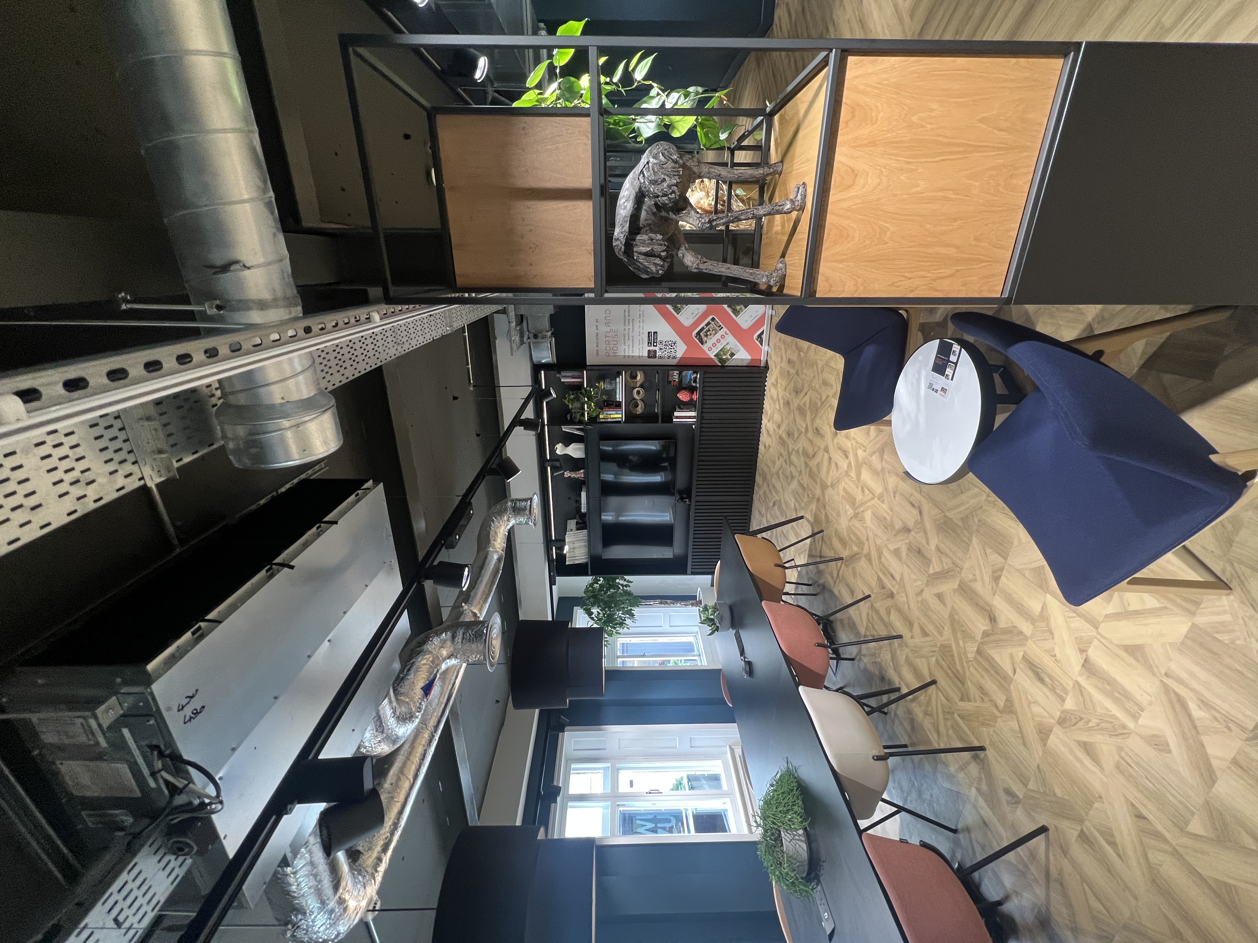 Modern meeting space with colorful chairs for creative events in Portland House.