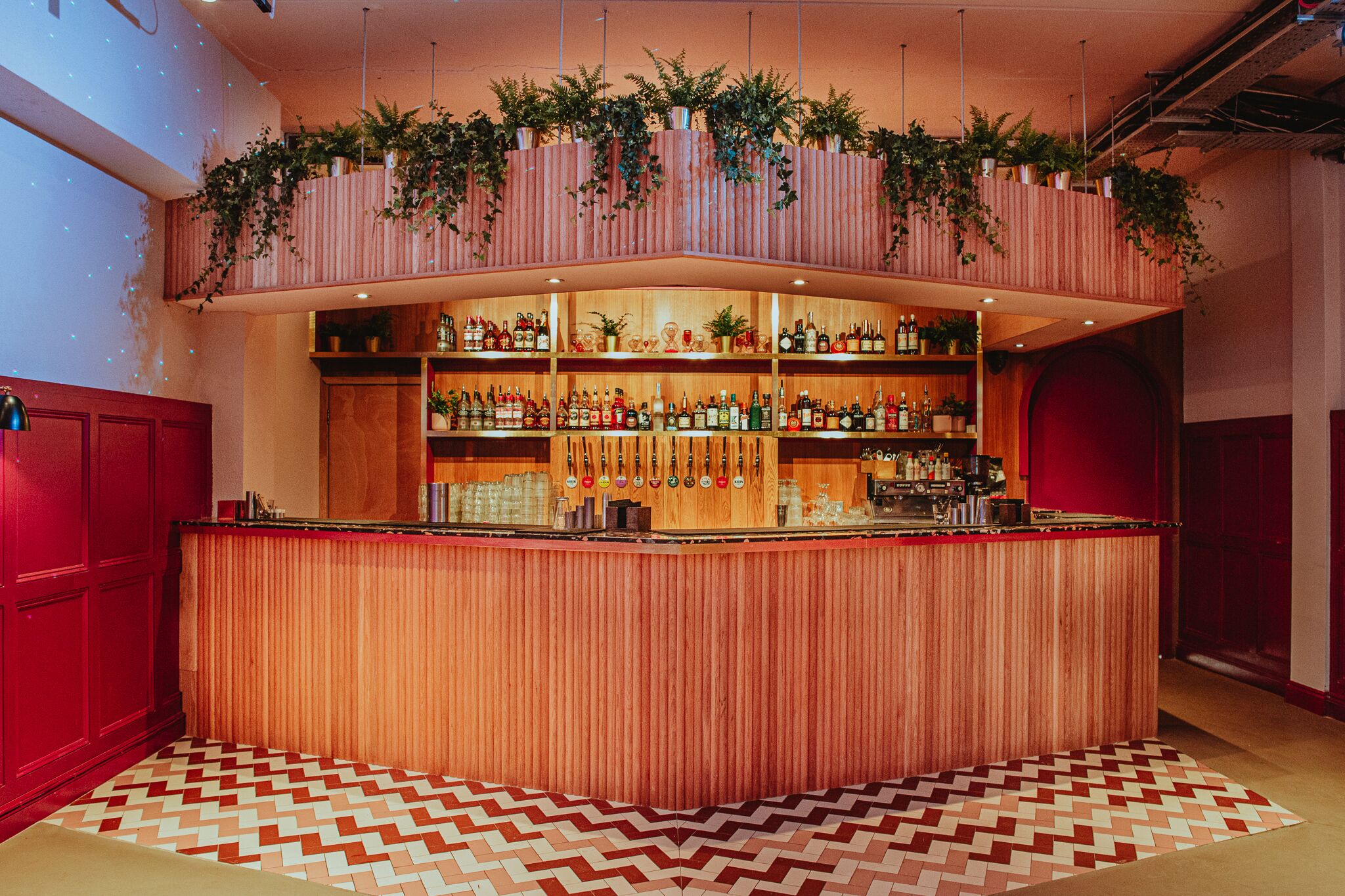 Main Bar & Terrace at Colours Hoxton with wooden counter, ideal for cocktail receptions.