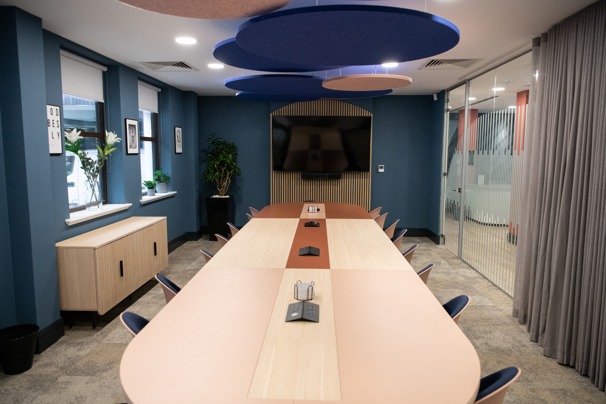 Modern conference room with elongated table for productive meetings at Wizu Workspace.