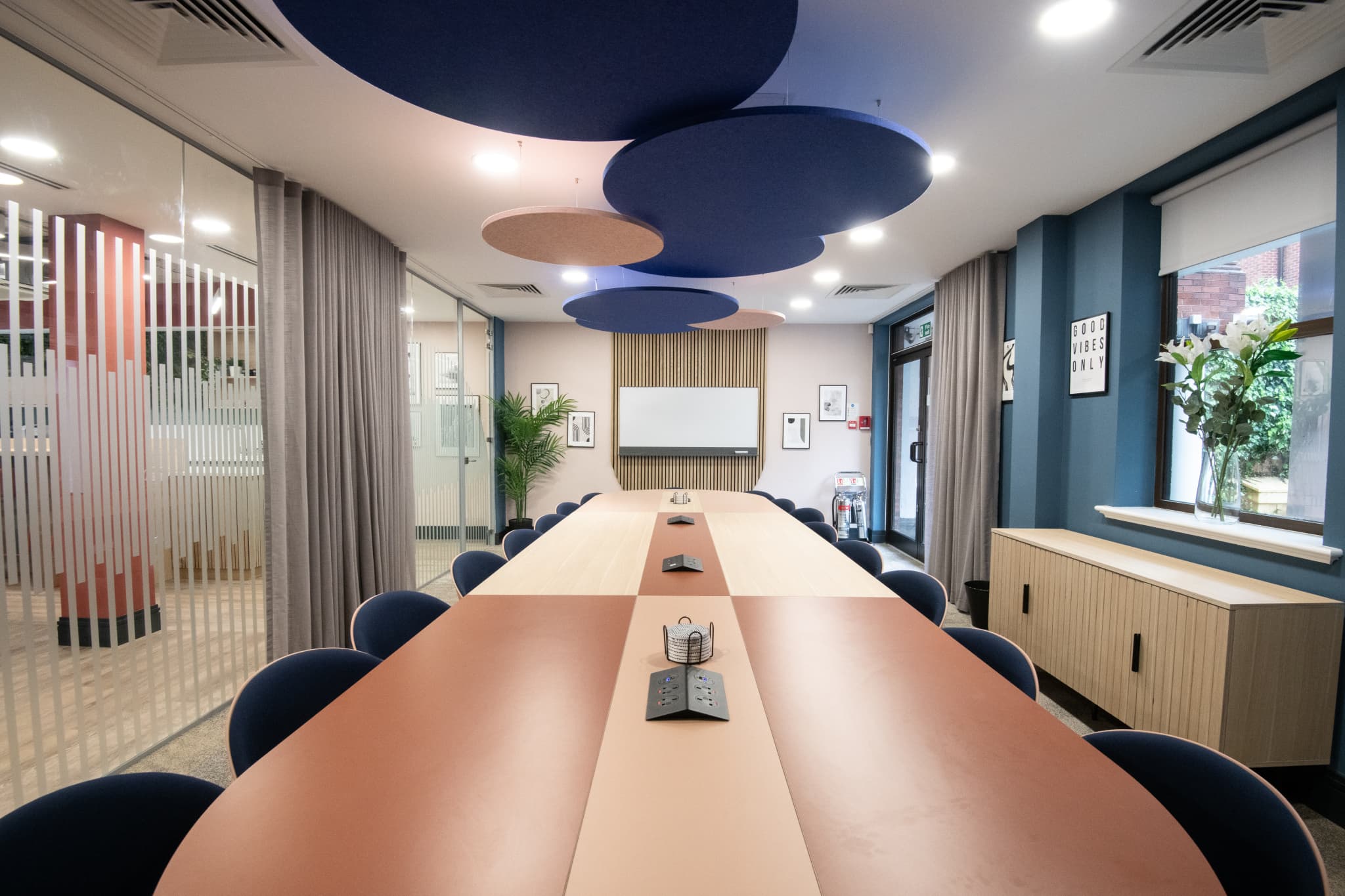 Modern Millennium Suite boardroom with dual-tone table for executive meetings and workshops.