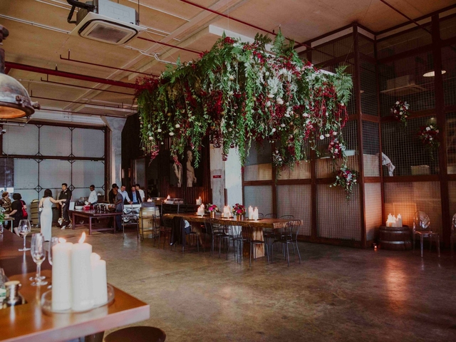 Elegant event space with floral installation, perfect for gatherings and celebrations.