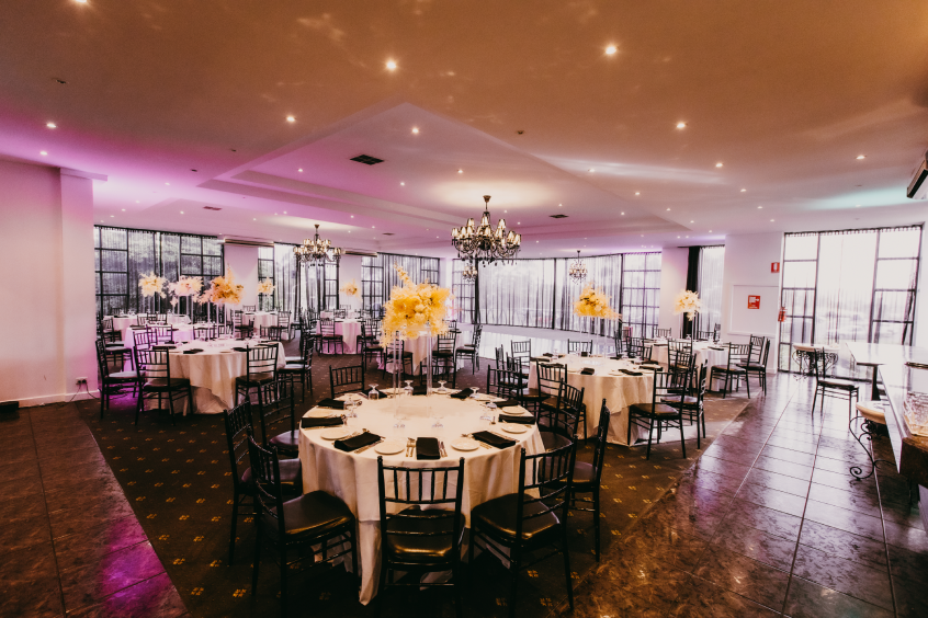 Elegant event space at Ultima Function Centre with round tables, ideal for weddings and corporate events.
