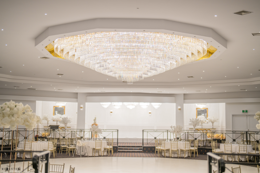 Elegant Pearl Ballroom with chandelier, perfect for weddings and corporate events.