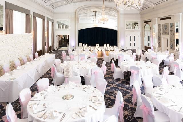 Balmoral Suite at The Castle Hotel Windsor, elegant wedding venue with floral backdrop.