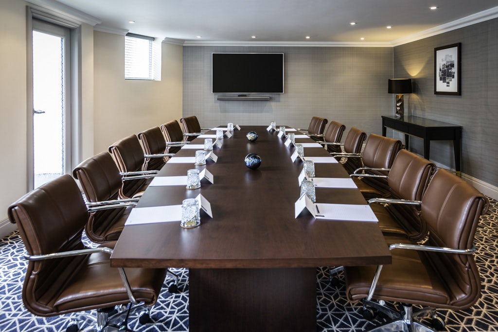 Boardroom at The Castle Hotel Windsor, modern furnishings for professional meetings.