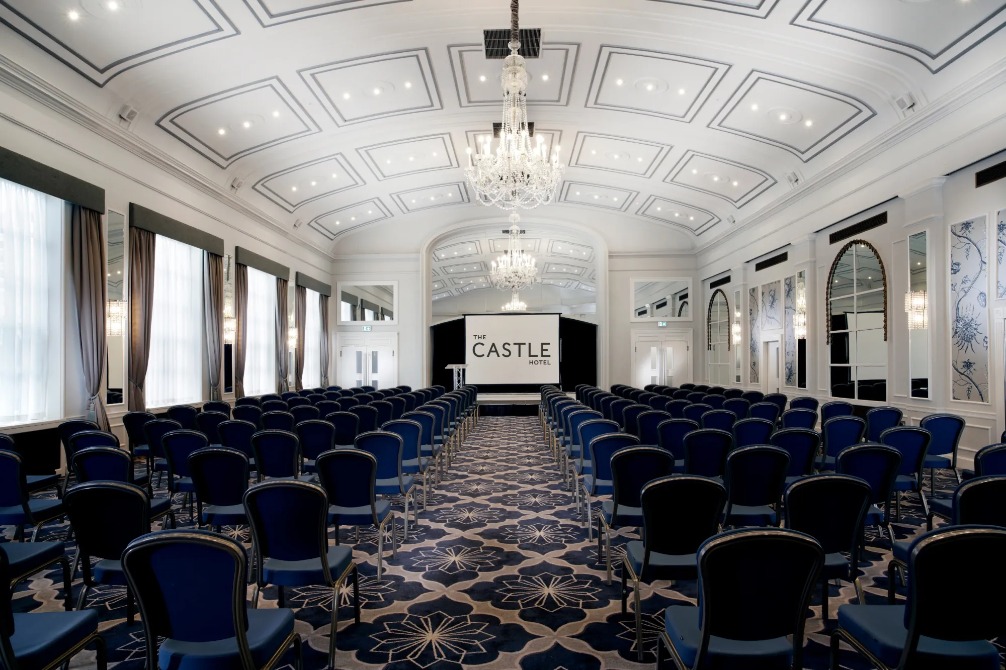 Boardroom at The Castle Hotel Windsor with elegant chandeliers for corporate events.