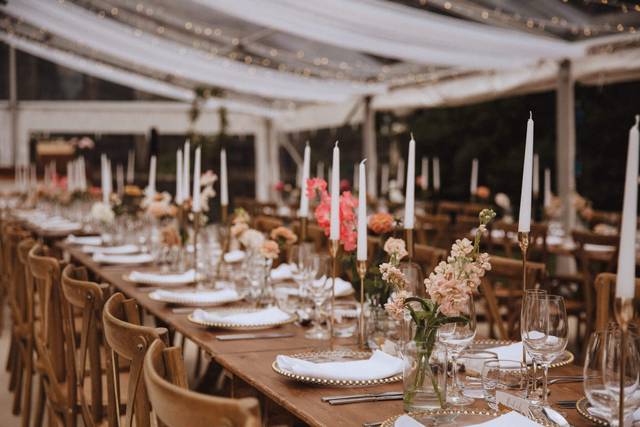Elegant dining setup with floral centerpieces at Sandon Hall for weddings and events.