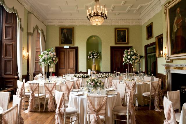 Elegant banquet room at Sandon Hall with floral centerpieces, ideal for weddings and events.