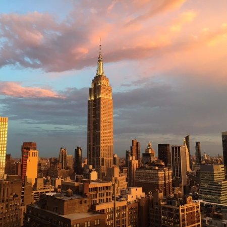 Rooftop Terrace at The Skylark with Empire State Building at sunset, ideal for events.