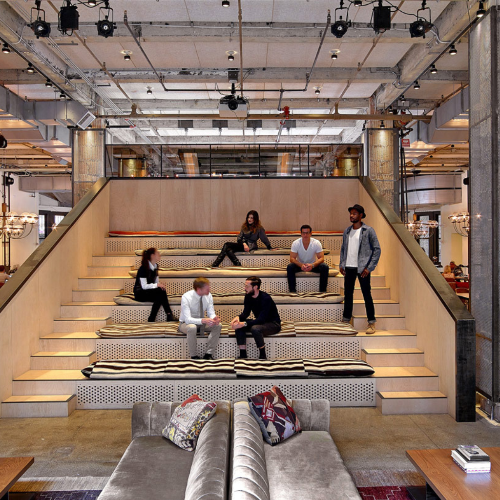 Modern private event space with tiered seating for workshops and brainstorming at NeueHouse.