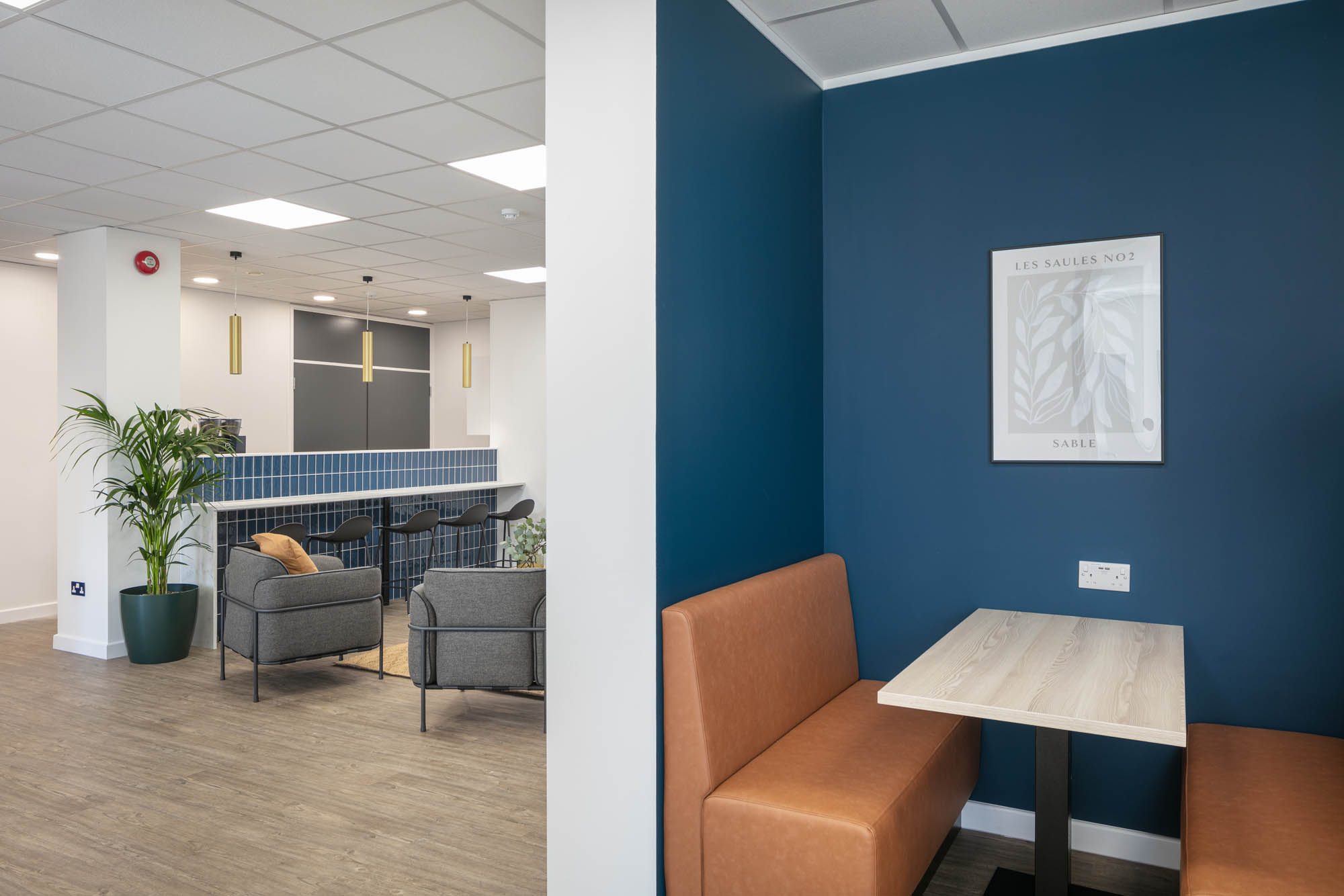 Modern meeting space with cozy seating for networking events at Common Ground Co Working.