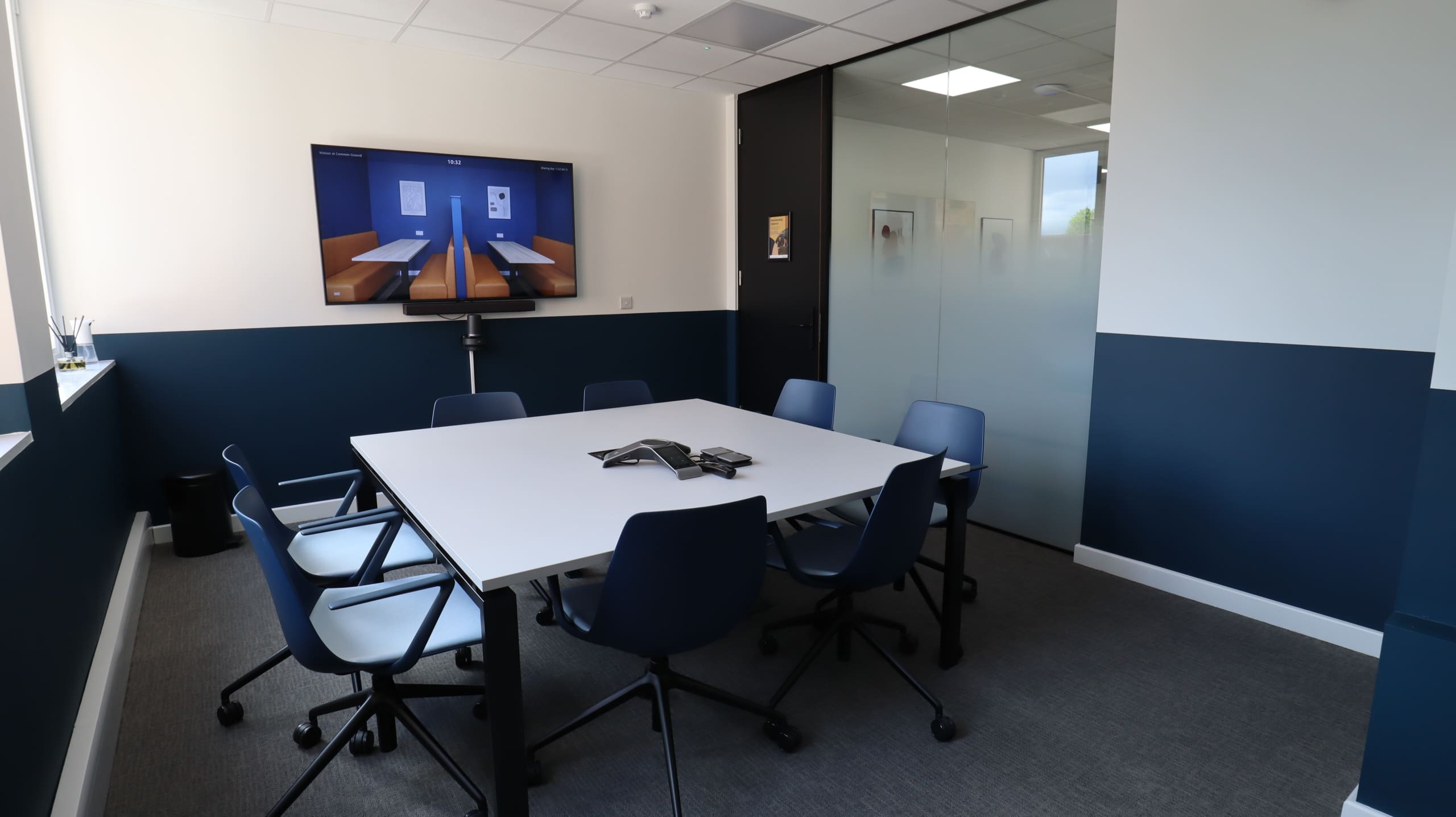 Modern meeting room with ergonomic chairs for collaboration at Common Ground Co Working.