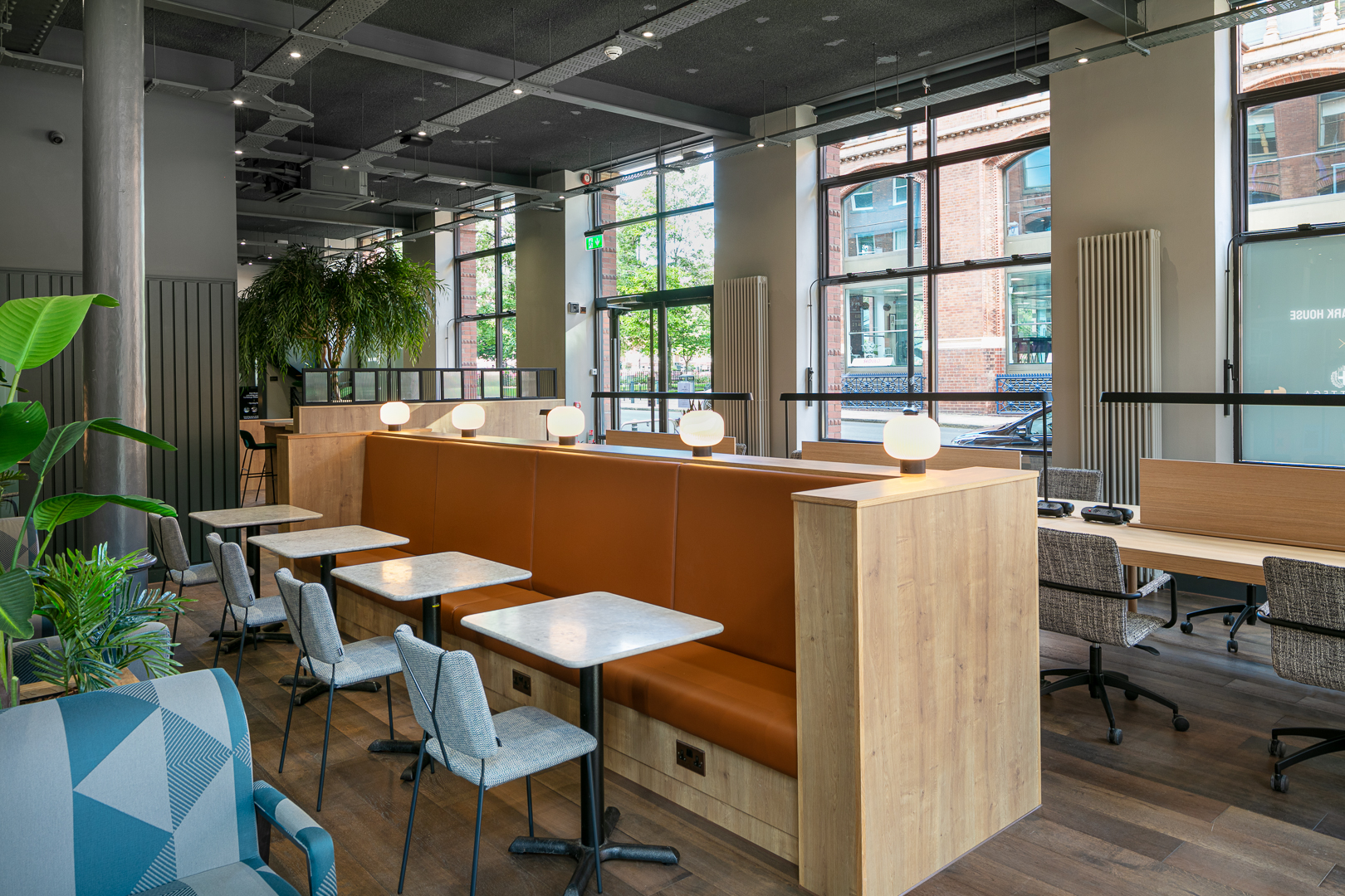 Modern coworking space with natural light, ideal for workshops and networking events.