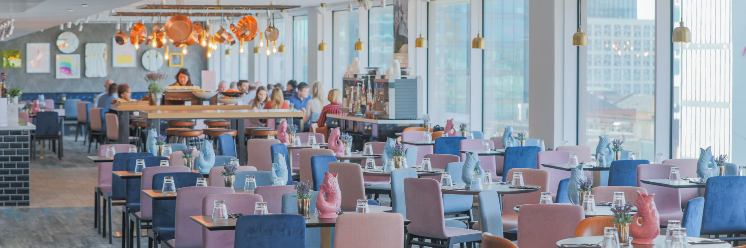 Modern meeting room in Etc.venues Manchester with vibrant chairs for events.