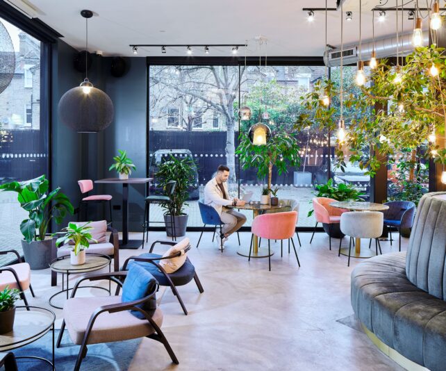 Modern meeting space in Fulham with greenery, ideal for creative brainstorming events.