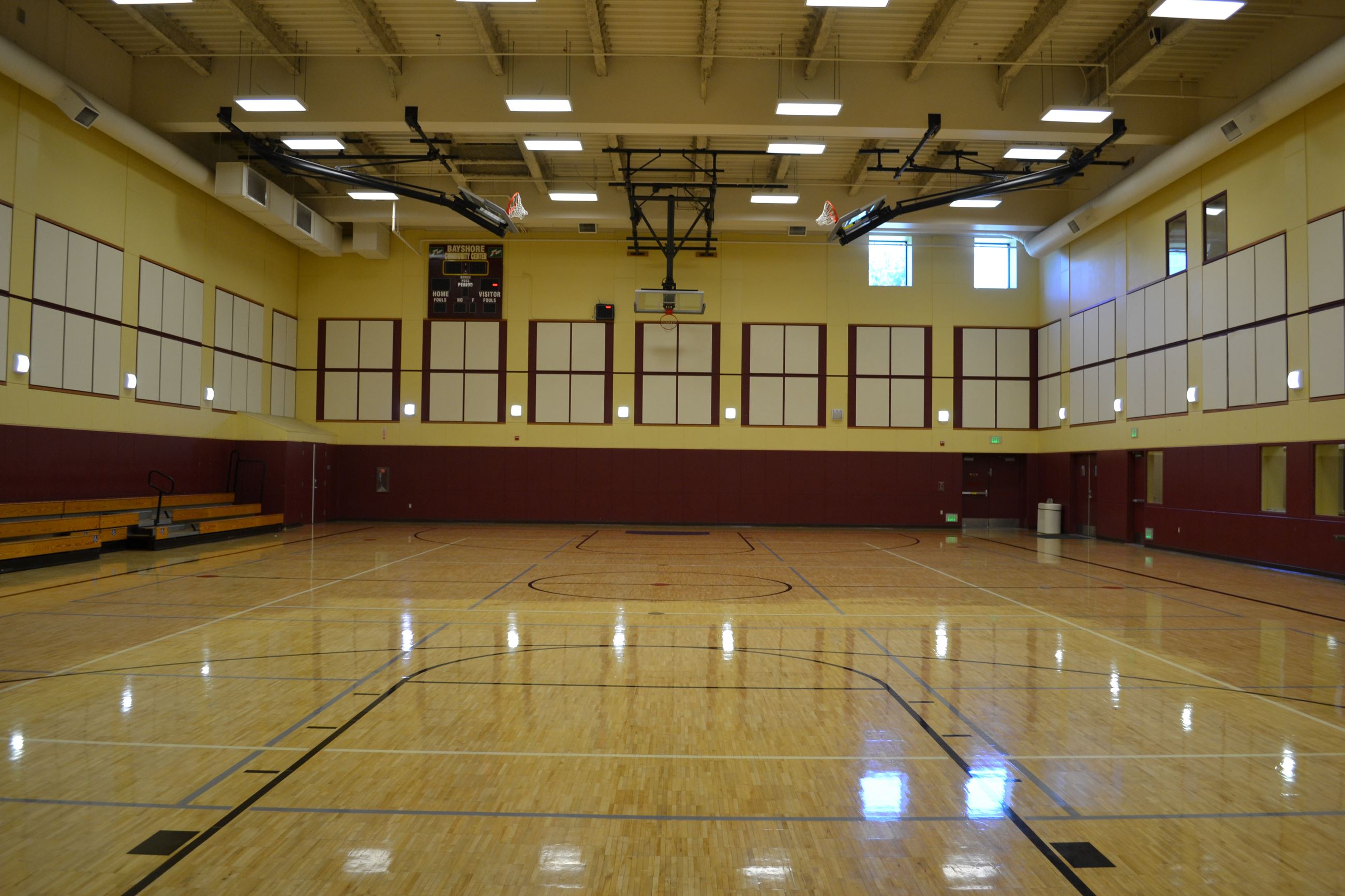 Spacious Bayshore Community Center auditorium with polished floors for events and gatherings.