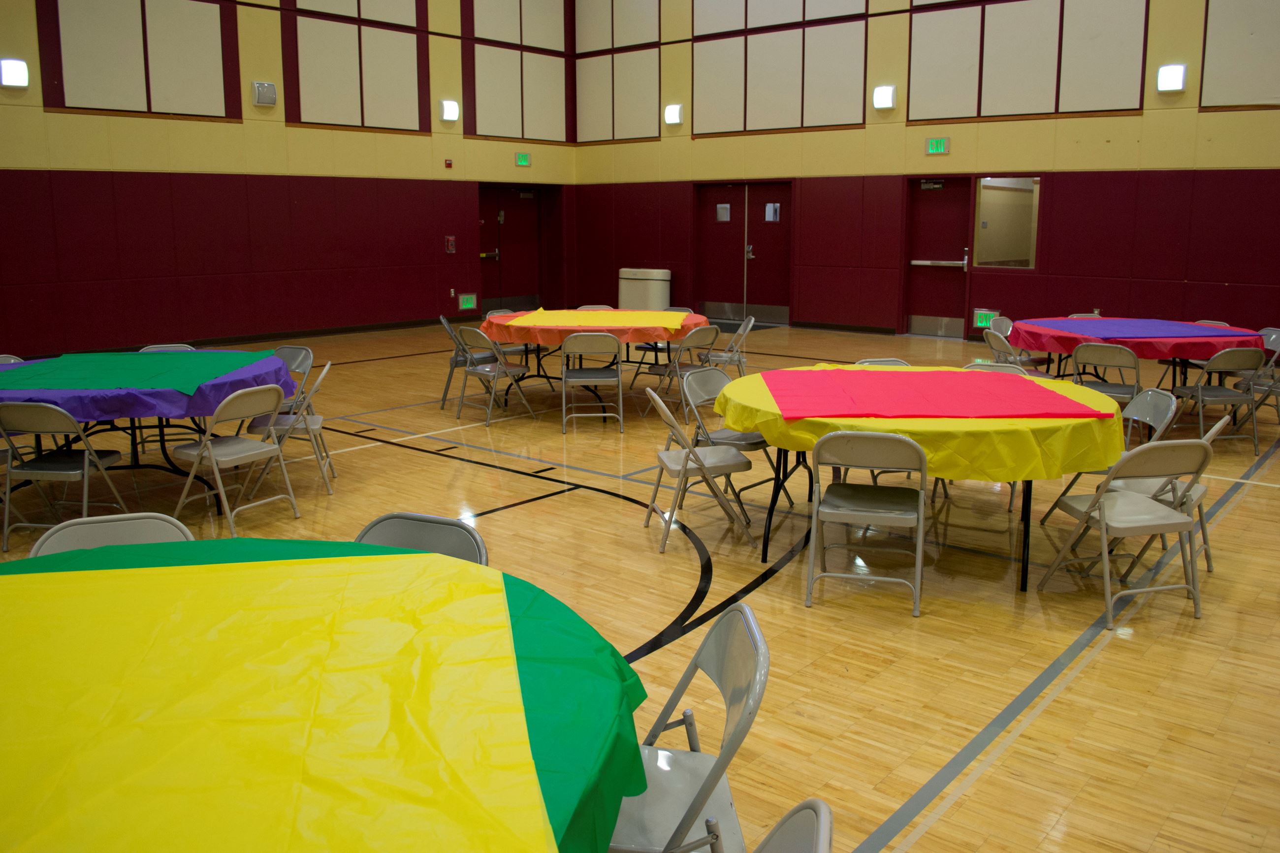 Bayshore Community Center activity room with colorful tables for community events and workshops.