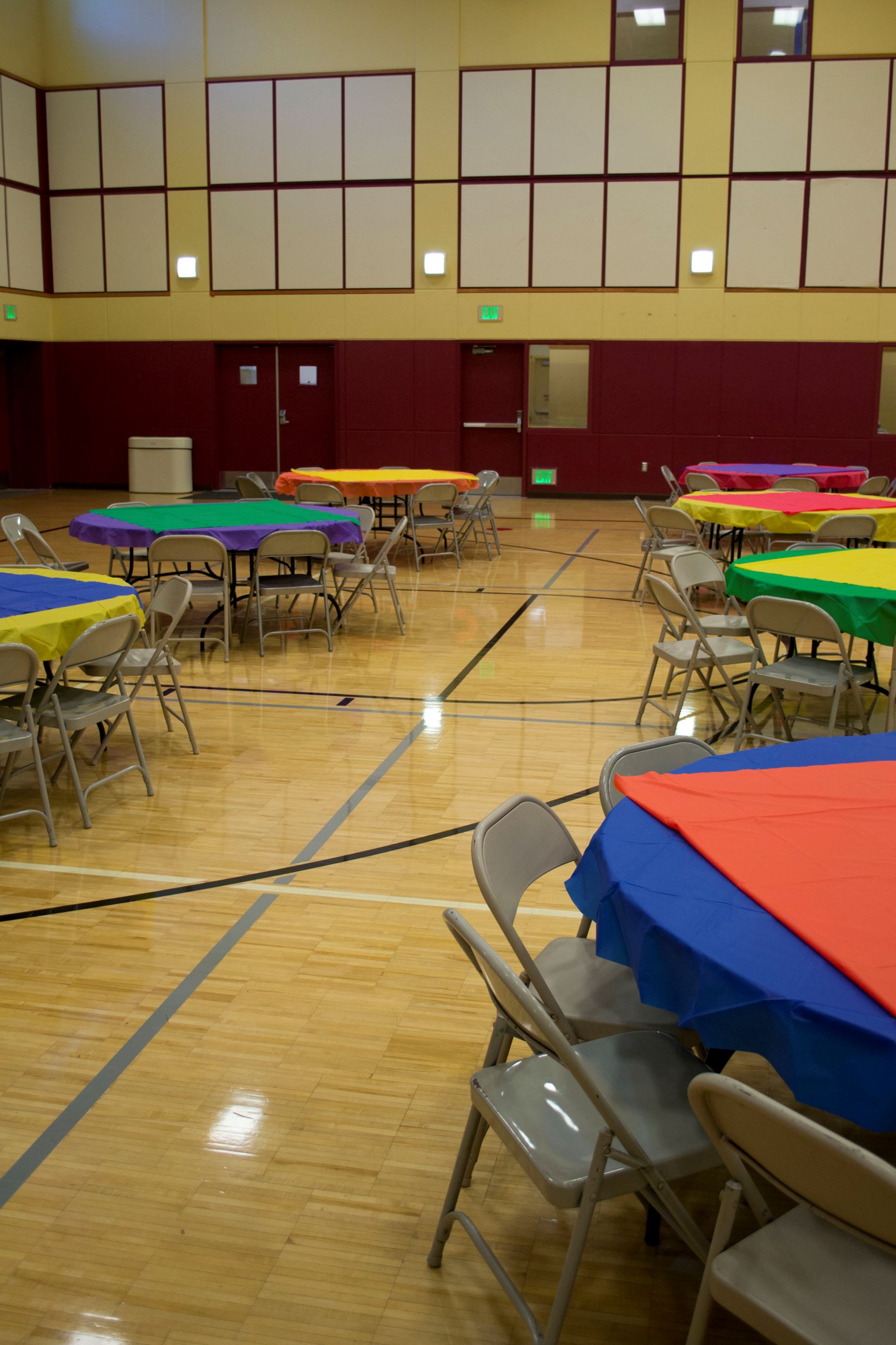 Vibrant event setup with colorful tables in Bayshore Community Center Activity Room.