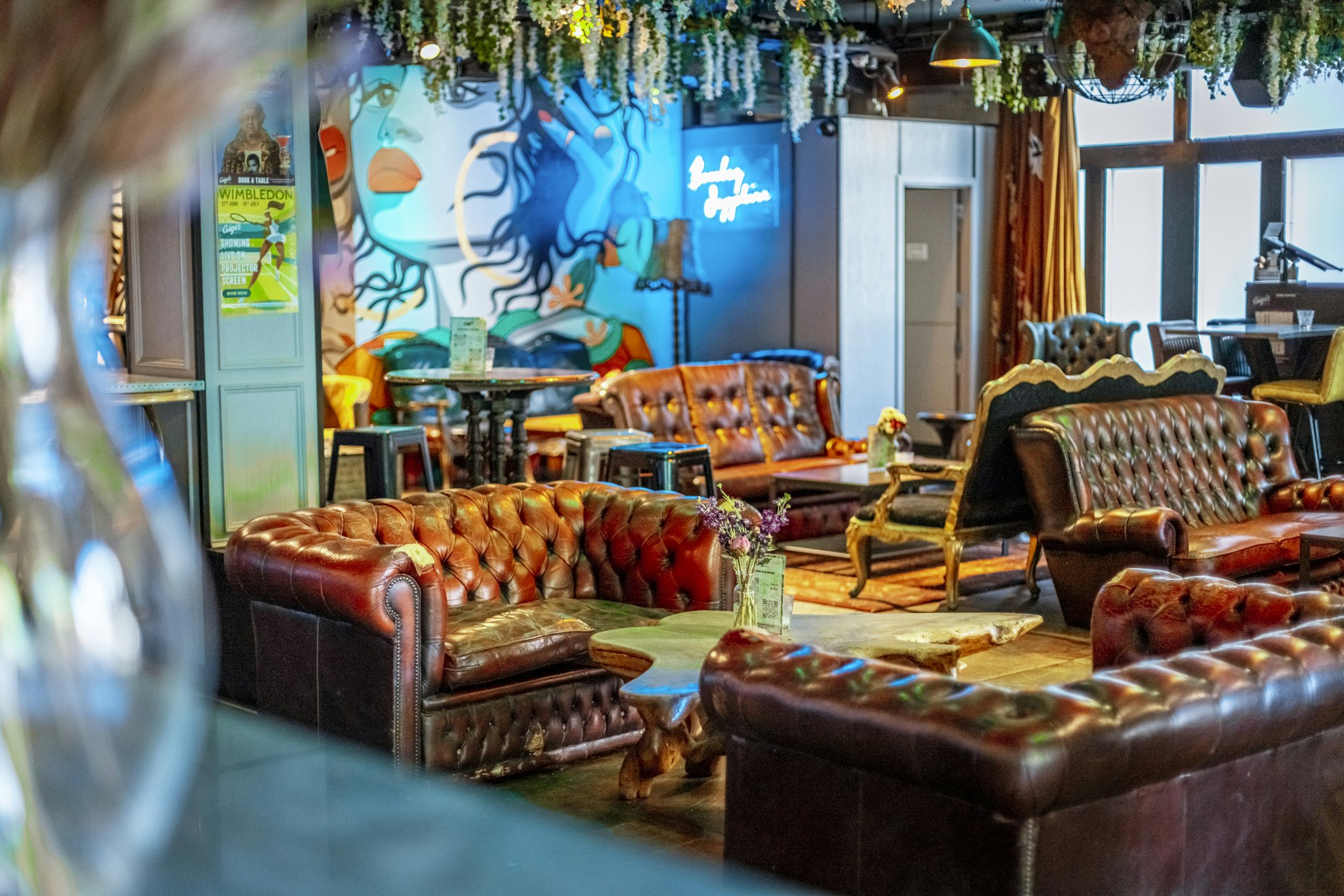 Stylish lounge with leather sofas at Gigi's Hoxton for networking events.