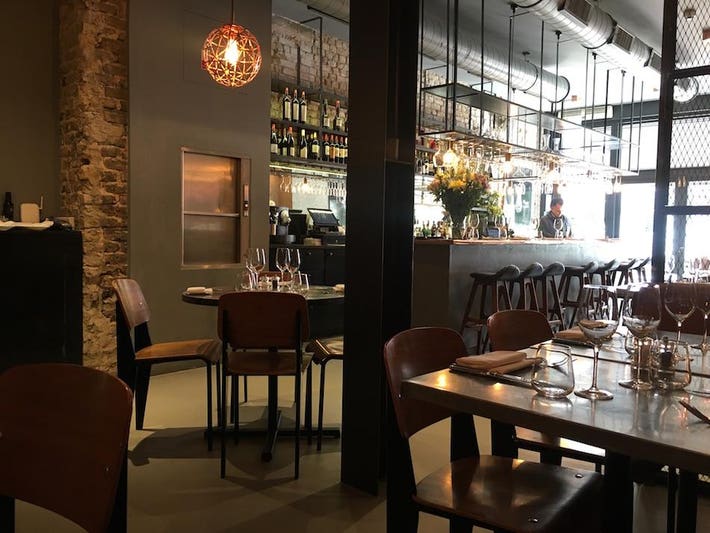 Stylish Margaux restaurant with warm lighting, perfect for intimate events and networking.