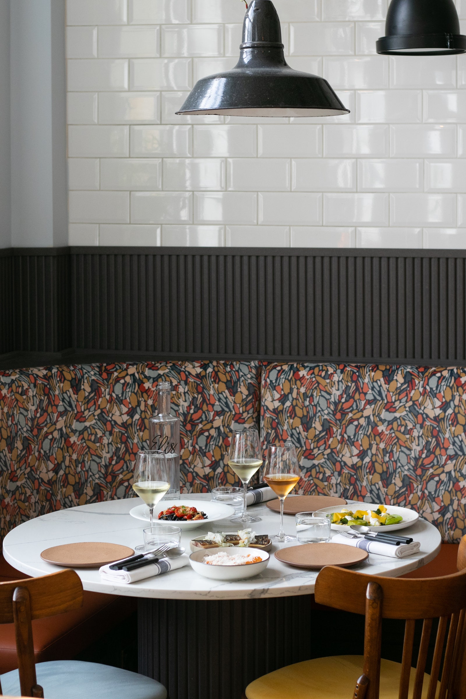 Stylish bar at Eli's Restaurant with cozy seating for networking events.