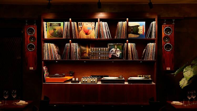 Stylish audio setup with vinyl records in Caia London for intimate gatherings and events.