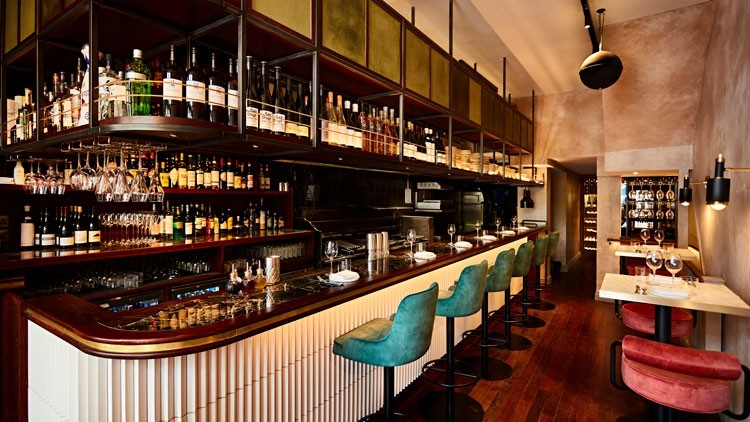 Stylish bar in Caia London with plush seating for networking events and cocktail receptions.