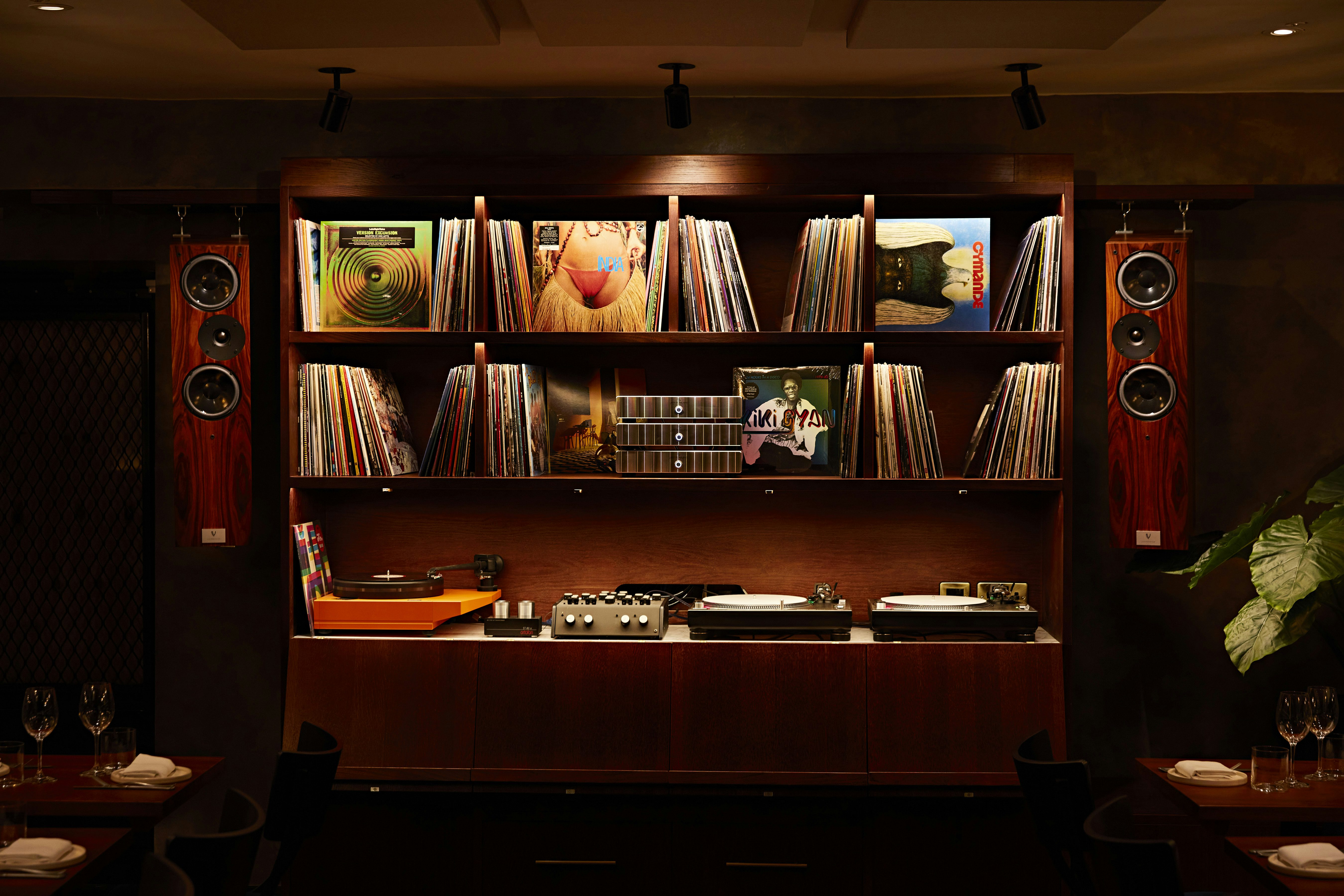 Stylish vinyl record display in Green Room, Caia London for events and gatherings.