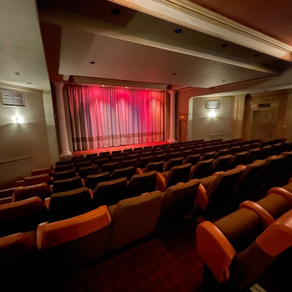 Curzon Richmond Cinema stage with vibrant curtains, ideal for conferences and performances.