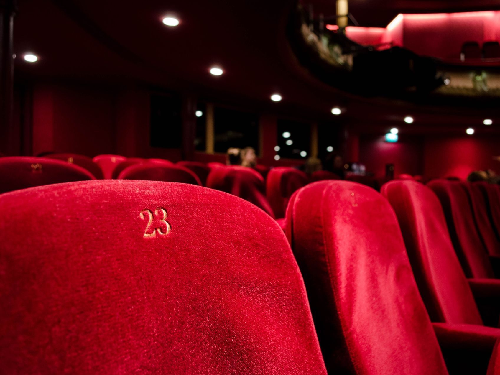 Plush red theater seat 23 at Curzon Richmond Cinema, ideal for elegant events.