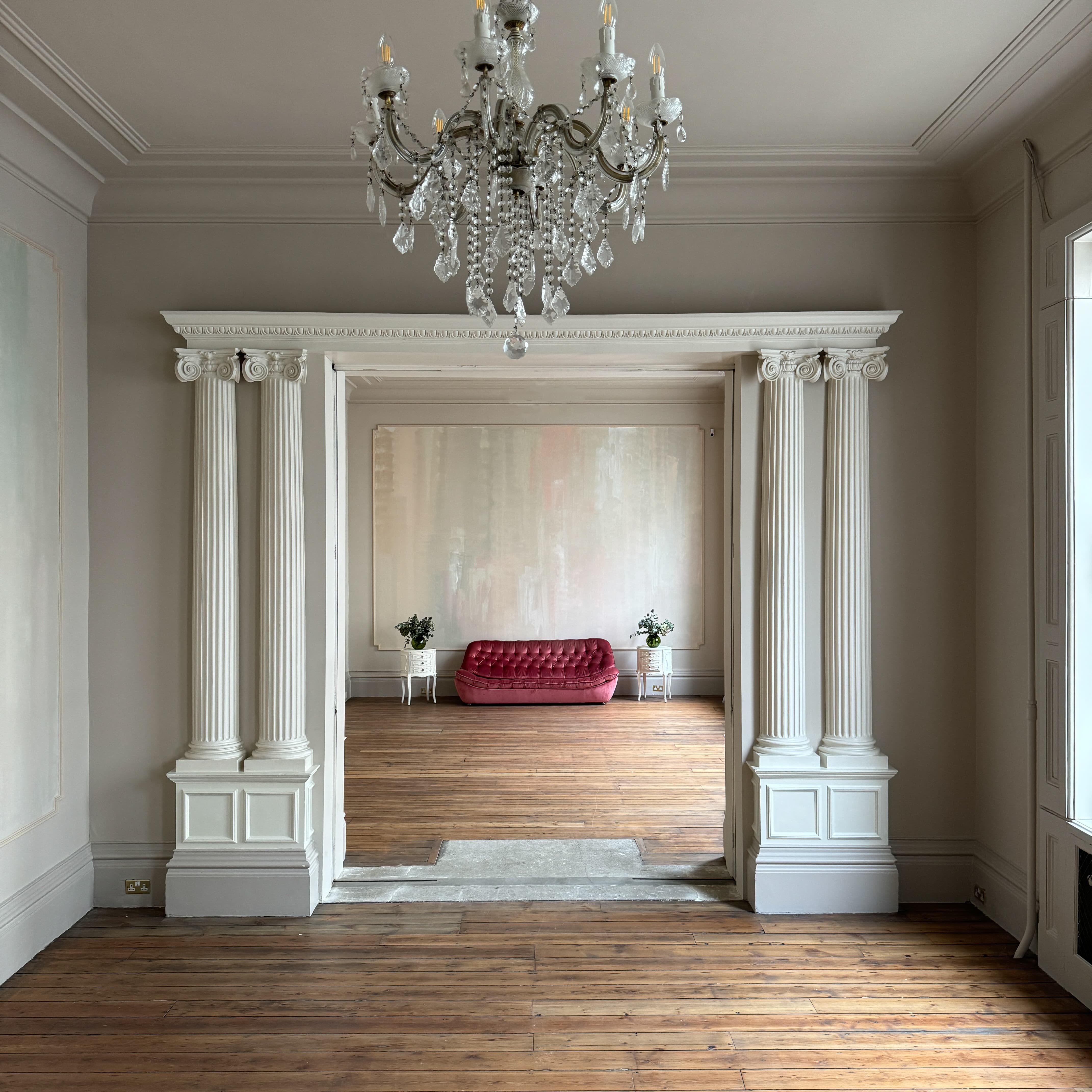 Elegant Lancaster Suite with red sofa, ideal for upscale meetings and gatherings.